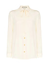 Silk shirt with bow by Gucci.