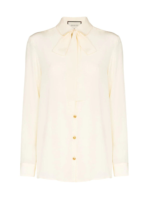 Silk shirt with bow by Gucci.