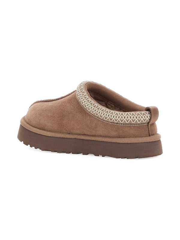 Slippers Tazz per bambini UGG Kids beige con rifiniture intrecciate