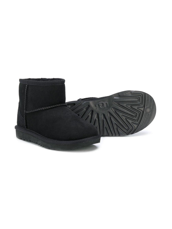 Stivali Classic Mini II per bambina UGG Kids neri con design slip-on